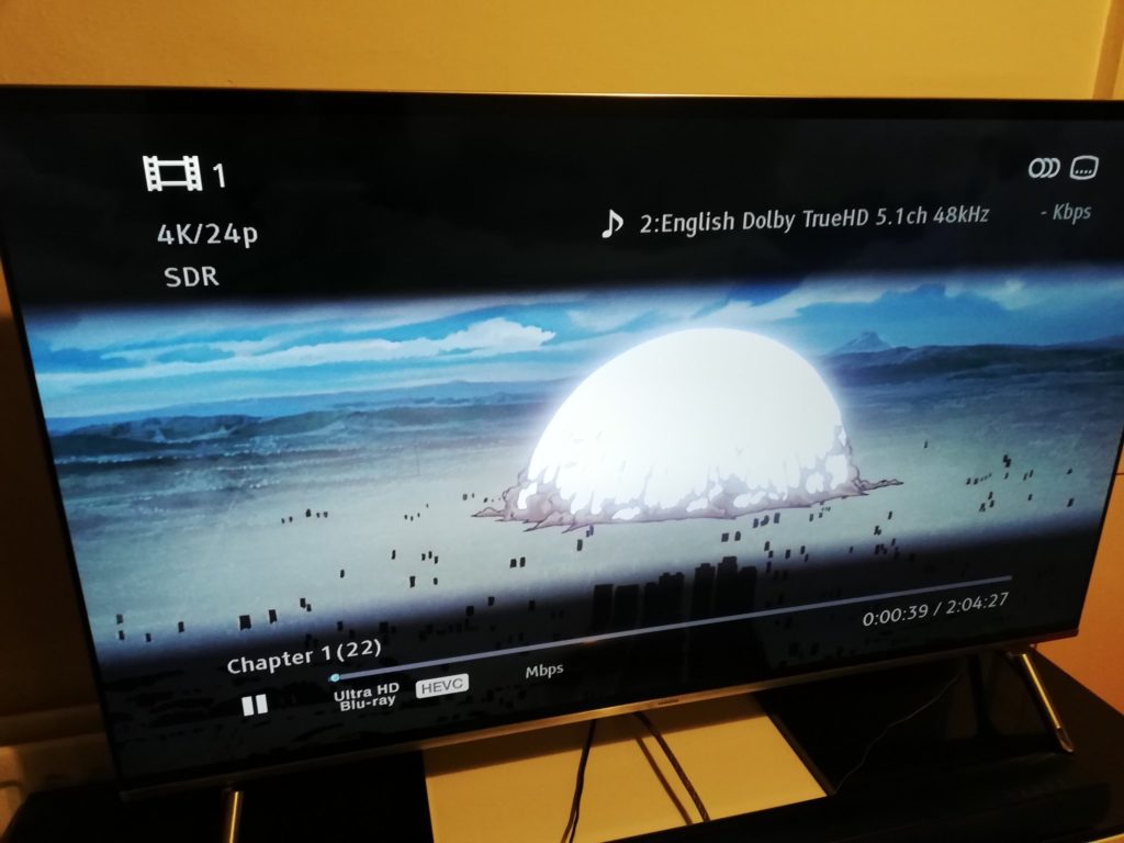 A photograph of Manga UK's Akira 4K release, with a TV indicating that it's SDR.